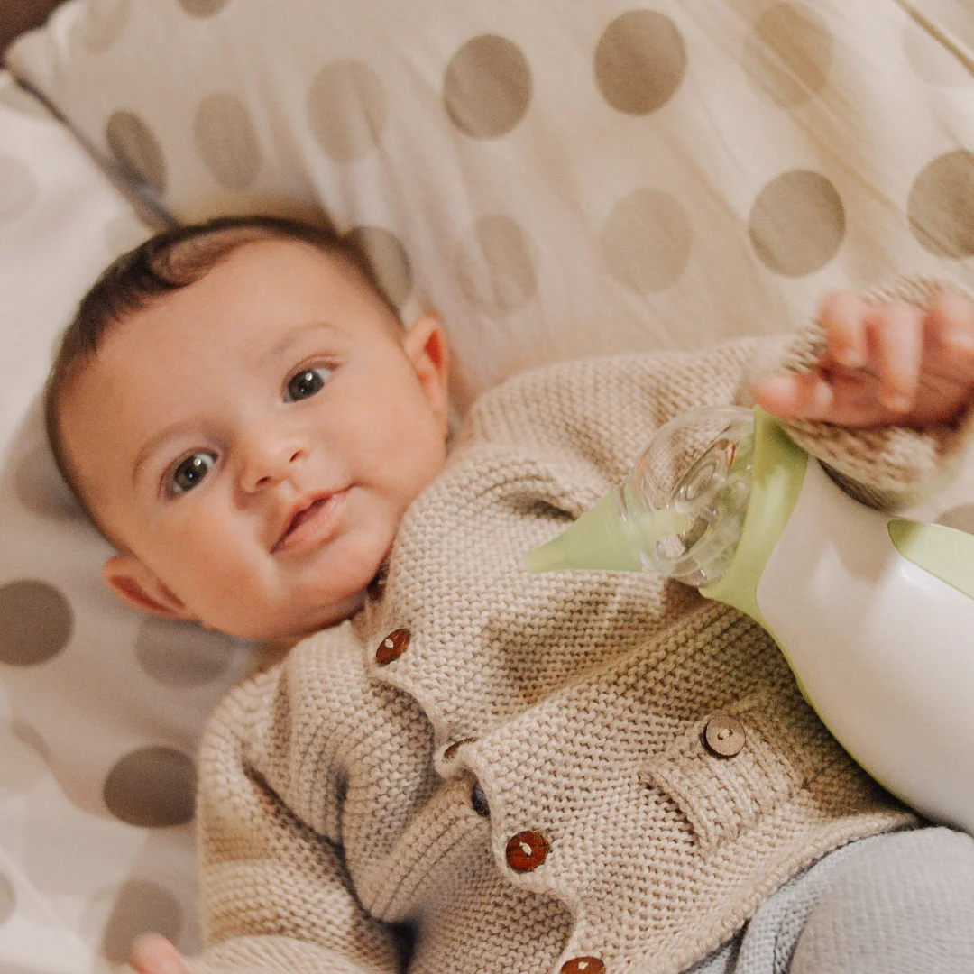 A little boy with the Nosiboo Go Portable Nasal Aspirator