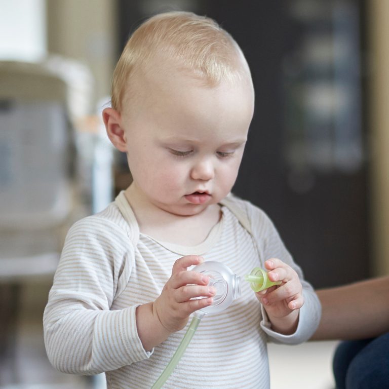 A little boy with the Nosiboo Pro Electric Nasal Aspirator